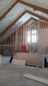 Sheetrocking front wall of Sanctuary