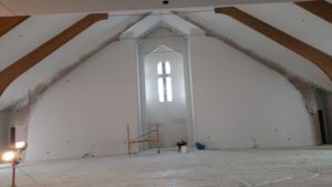 Sanctuary front wall after being primed